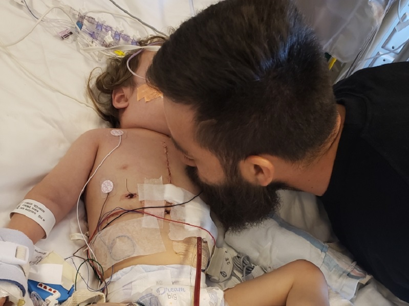 0311babyrubencarlos Dad Carlos kisses Ruben after his heart transplant.