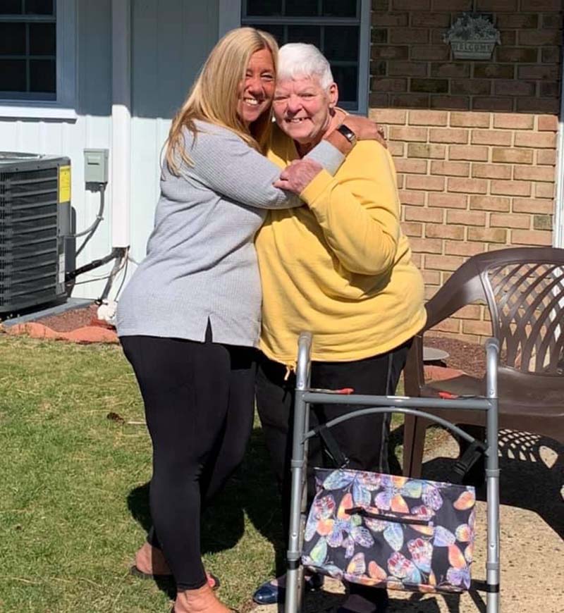 0507bhsocialisolationdementia Abby Stopfer Lundy, left, hugs her mother, Barbara Stopfer, for the first time in more than a year, since pandemic lockdowns began. (Photo courtesy of Abby Stopfer Lundy)