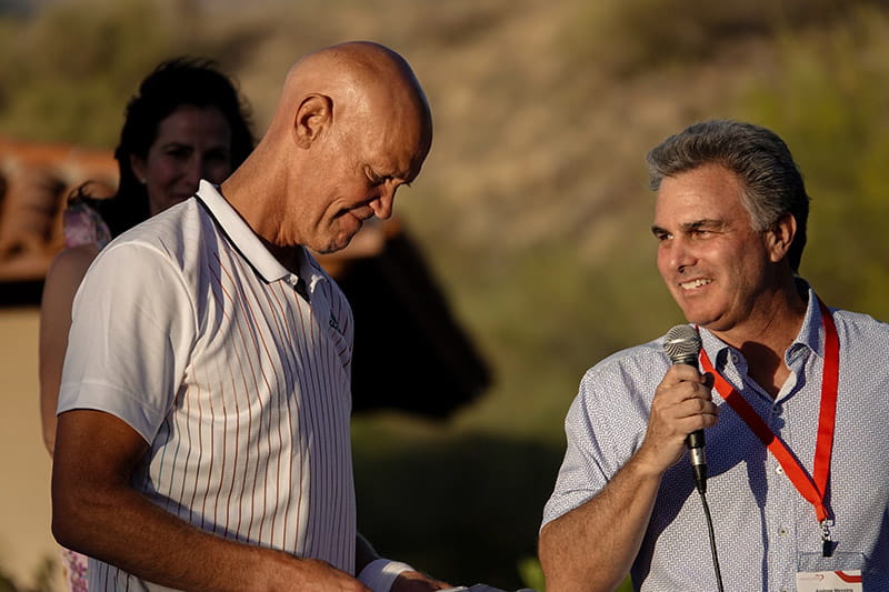 Andrew Messing (right) presents Murphy Jensen with the Stephen M. Gootter Philanthropic Award at the foundation's 2022 event. (Photo courtesy Matt Fitzgerald/Tennis Channel)