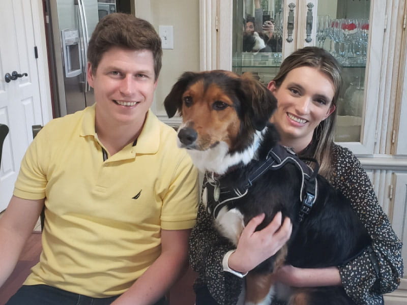 Cardiac arrest survivor Ken Walsh (left) with his wife, Nicole, and dog, Indiana. (Photo courtesy of the Walsh family)