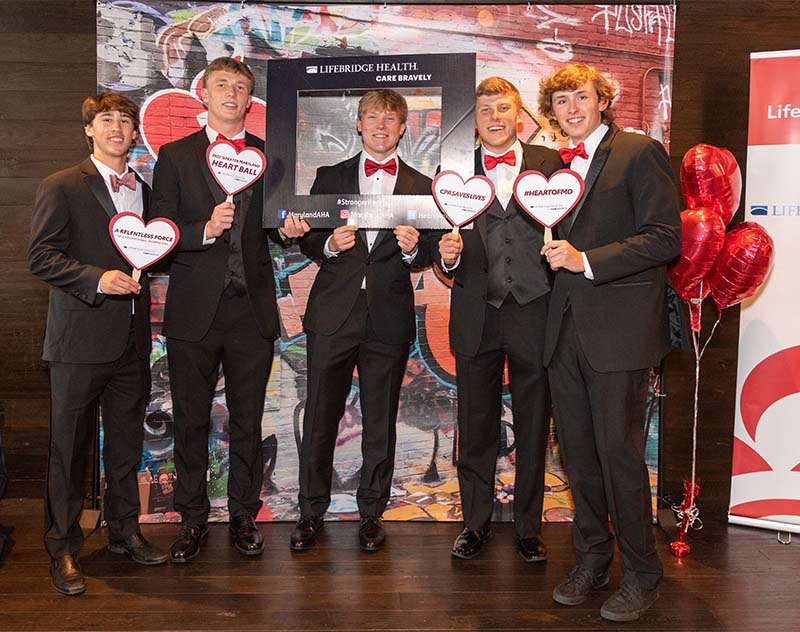 Peter Laake (center) with some of his lacrosse teammates – who were on the field when Peter collapsed – at the Baltimore Heart Ball. From left: Jack Schoenwetter, Billy Dwan, Peter, AJ Larkin and Pat Buch. (American Heart Association)