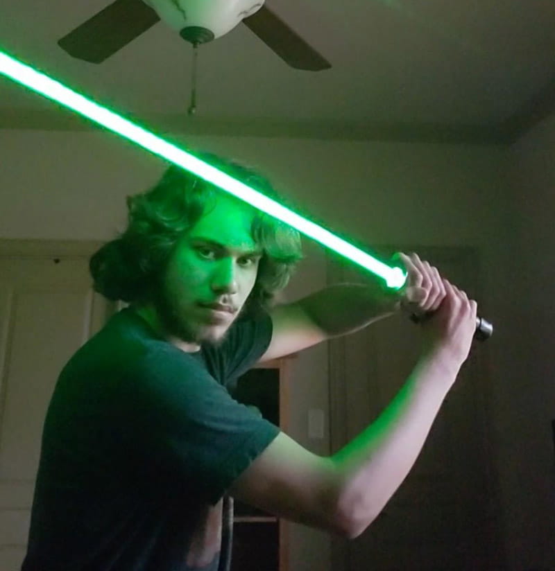 Star Wars fan Dylan Dorrell with the green lightsaber he made. (Photo courtesy of the Dorrell family)