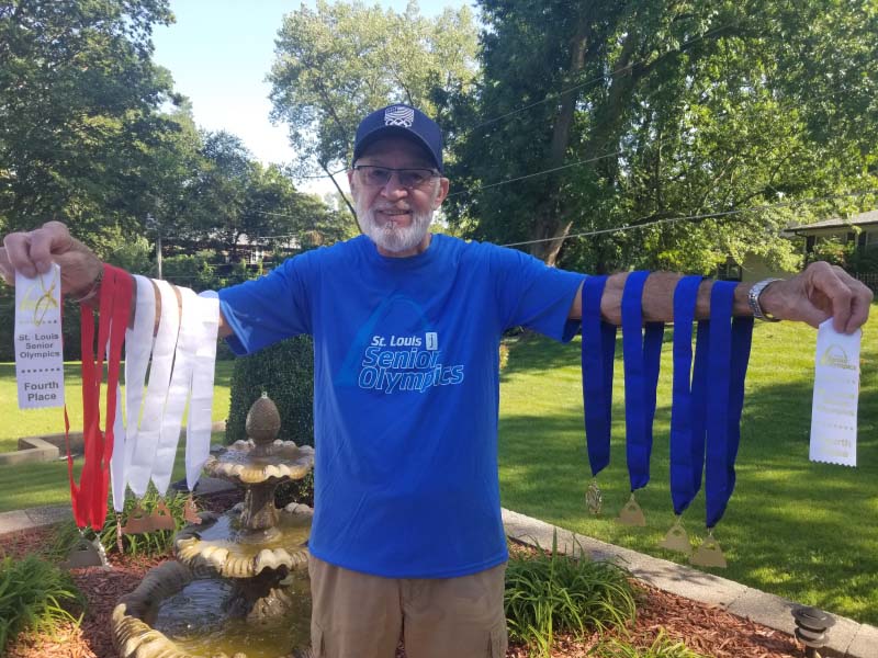 Don Young with medals he has won competing in the St. Louis Senior Olympics. (Photo courtesy of Don Young)