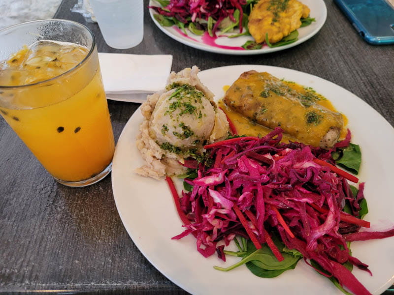 At one of her favorite cafés in San Juan, Puerto Rico, Josiemer Mattei enjoys traditional foods: fresh-pressed natural passion fruit juice; majado de vianda (mashed root vegetable); red cabbage, carrot and beet salad; and salmon filet in acerola sauce. (Photo courtesy of Josiemer Mattei)