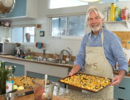 Christopher Gardner in his kitchen preparing to roast butternut squash, eggplant and tempeh. (Photo courtesy of OPS Productions)