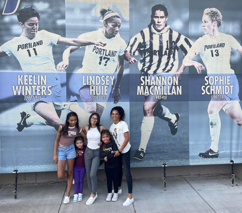Lindsey Huie (right) with her children (from left) Kinsley, Rylie, Kaia and Mimi at the University of Portland, where the soccer player was inducted into the school's Athletic Hall of Fame in 2022. (Photo courtesy of Lindsey Huie)